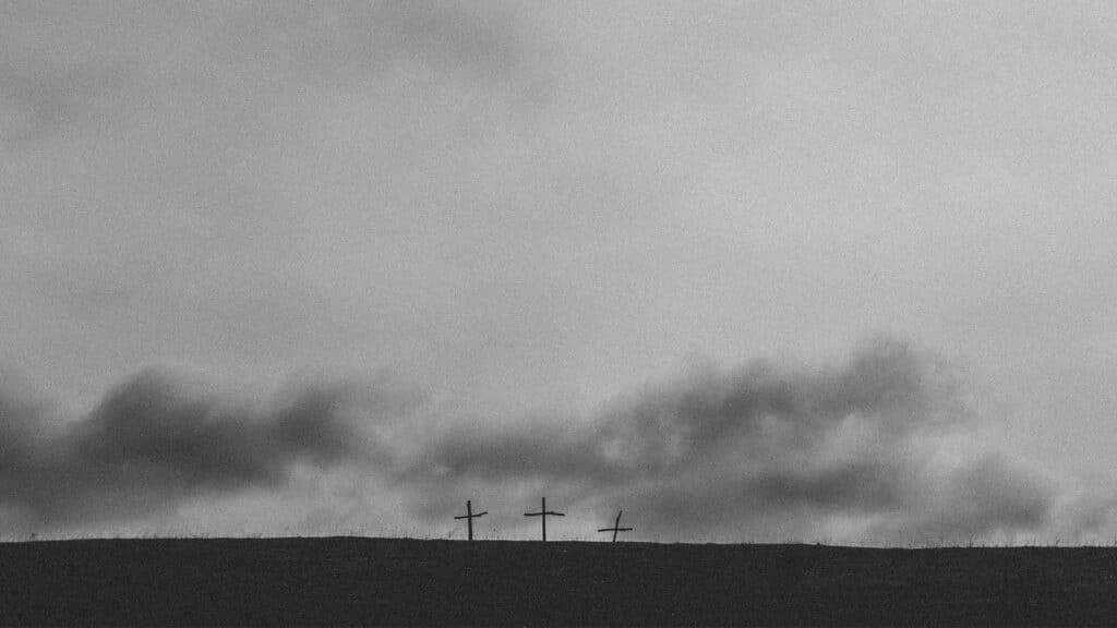 three-cross-under-cloudy-sky